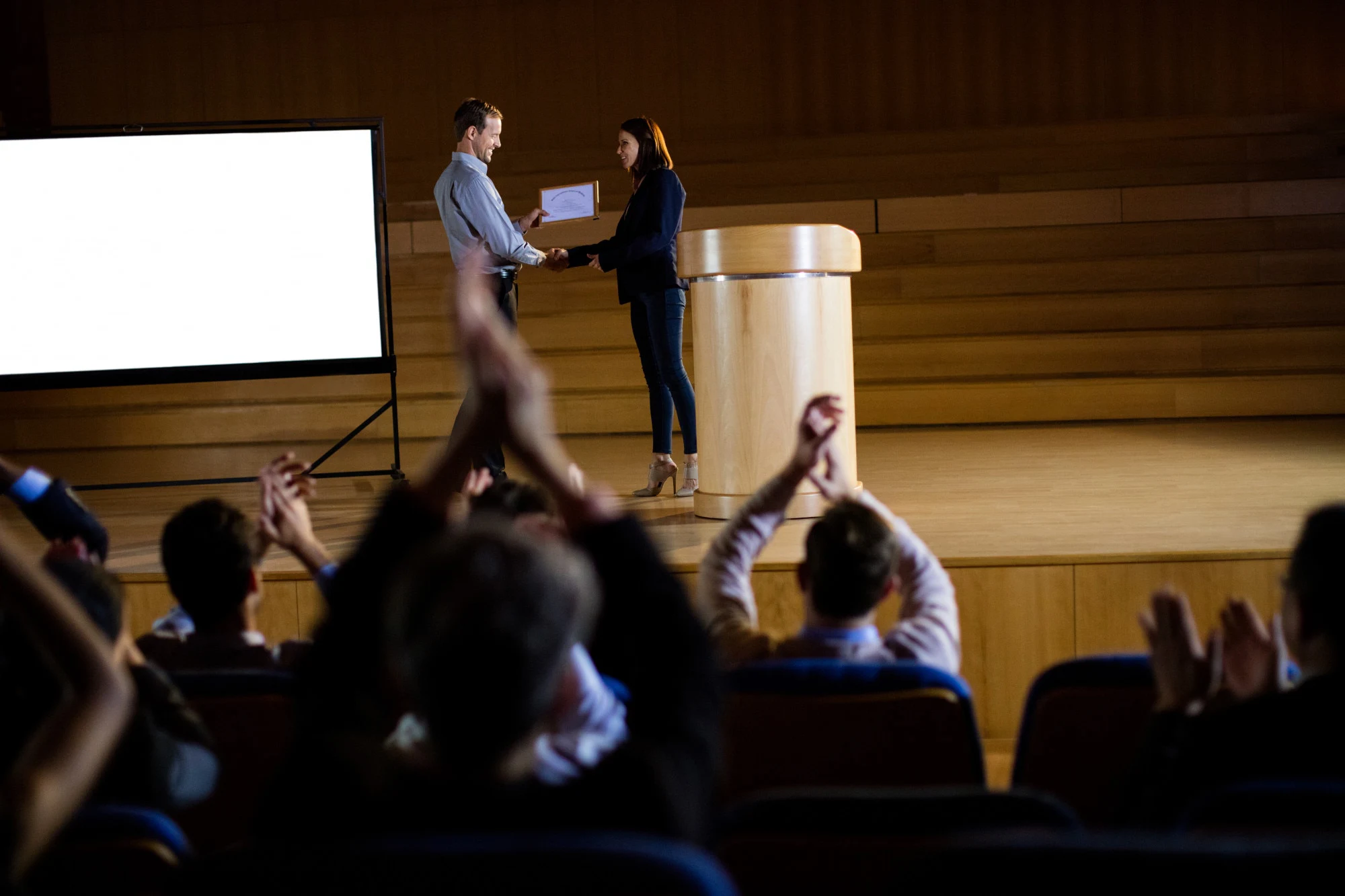 female-business-executive-receiving-award_107420-6